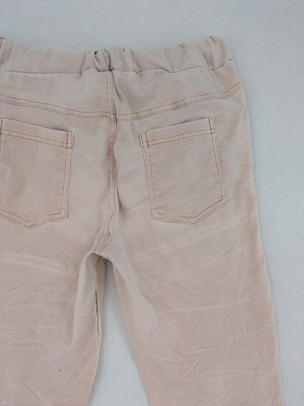 Made In Italy beige pants with crinkle texture and rock-style patches, drawstring waist.