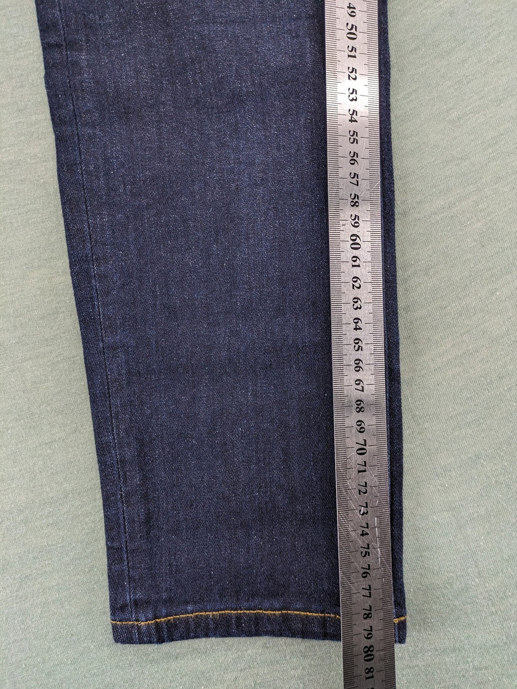Esprit navy straight jeans with five-pocket style and yellow contrast stitching.
