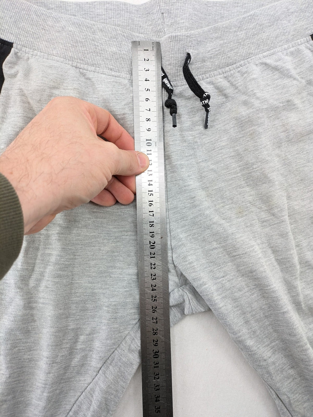 Fortnite pants grey with black side stripes and large logo print, cotton blend material.