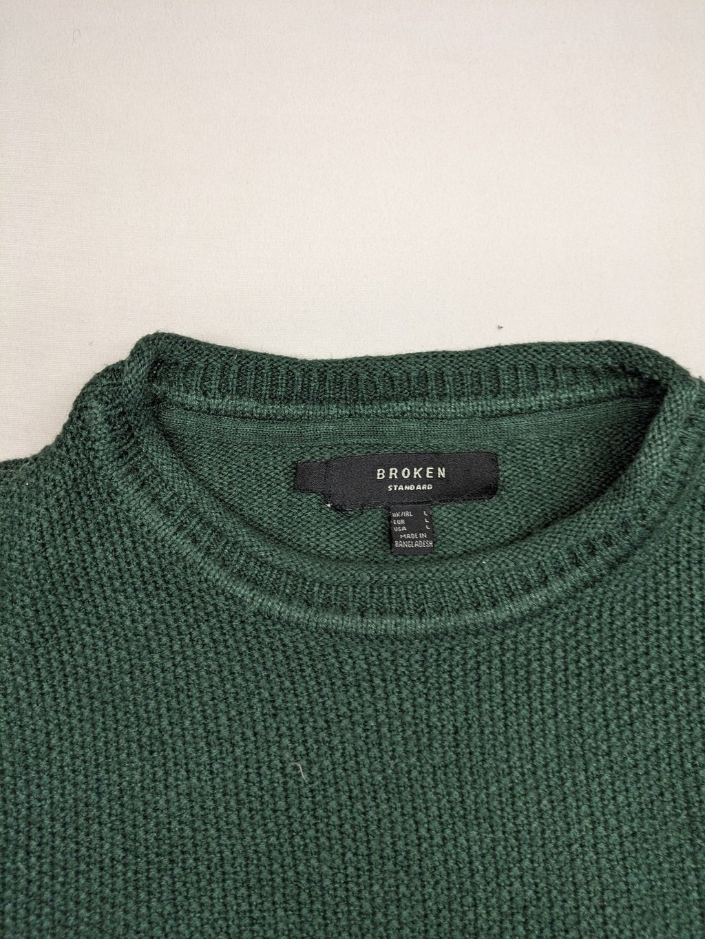 Broken Standard turtle neck jumper green waffle knit texture with classic round neckline.