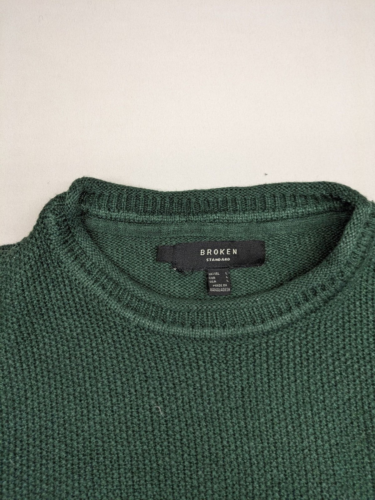 Broken Standard turtle neck jumper green waffle knit texture with classic round neckline.