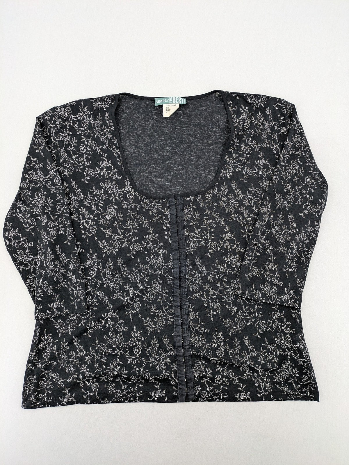 Simply The Best black top with white floral pattern and gathered front detail.
