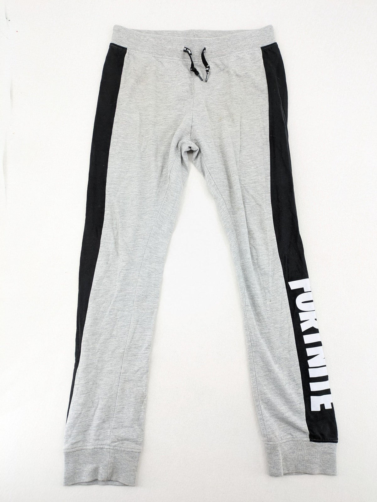 Fortnite pants grey with black side stripes and large logo print, cotton blend material.