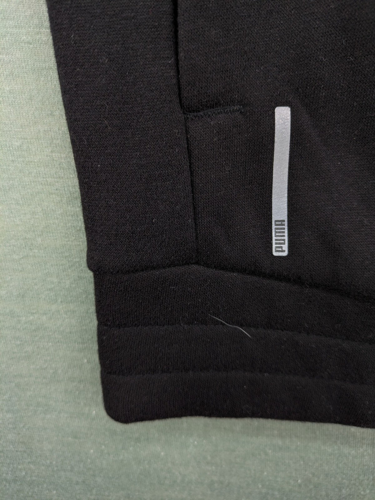 Puma grey zip-through hoodie with iconic logo and two practical pockets.