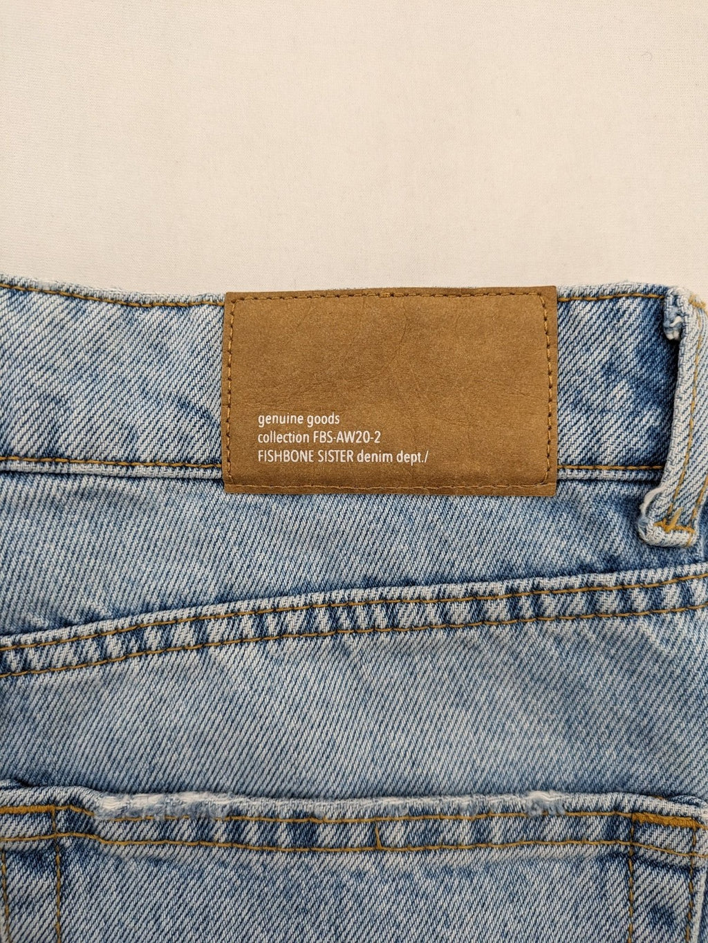 FB Sister blue straight leg jeans high rise with distressed detailing and button fly.
