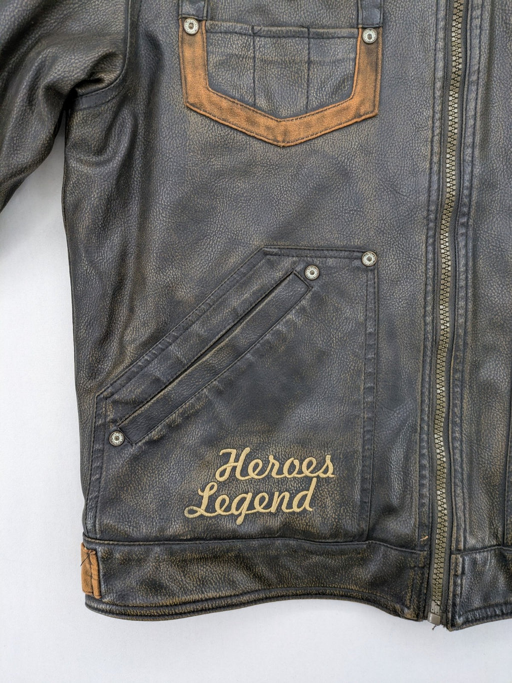 Junge brown bomber jacket with vintage patches and embroidered details in faux leather.