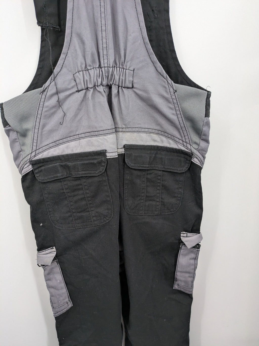 Cargo pants black grey two-tone design with red stitching and multiple pockets