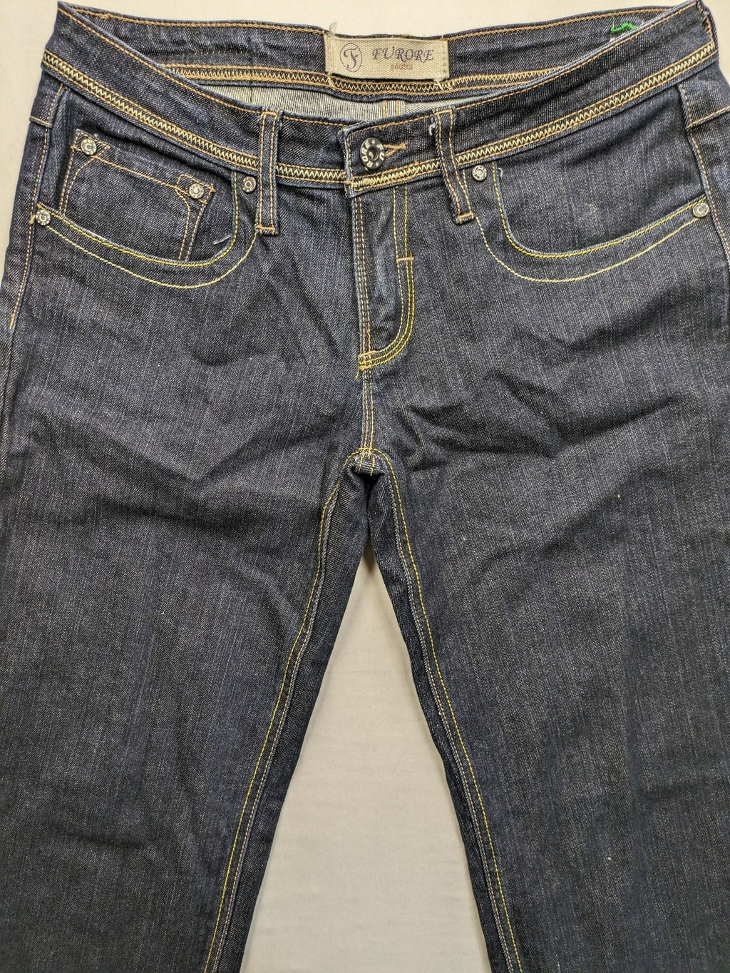 Furore blue straight jeans with yellow contrast stitching and zipper details.