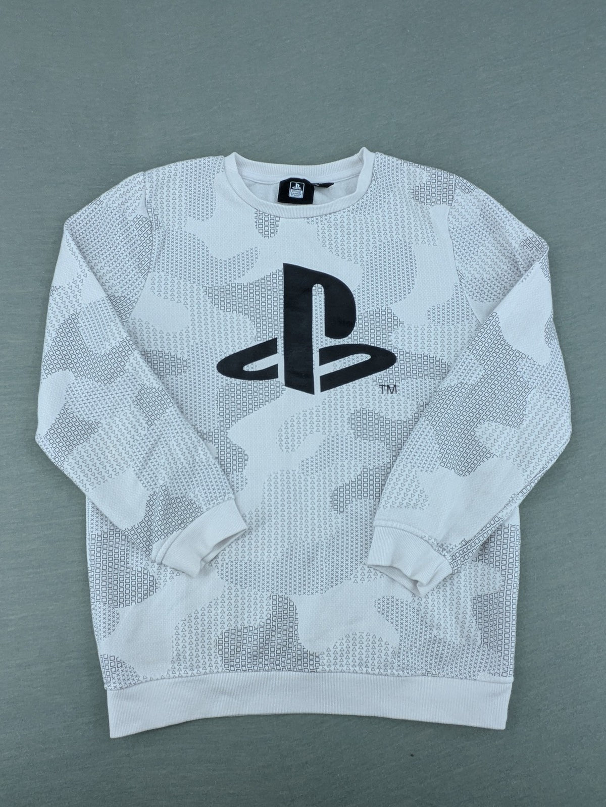 PlayStation grey sweatshirt with white logo and camo pattern featuring controller symbols.