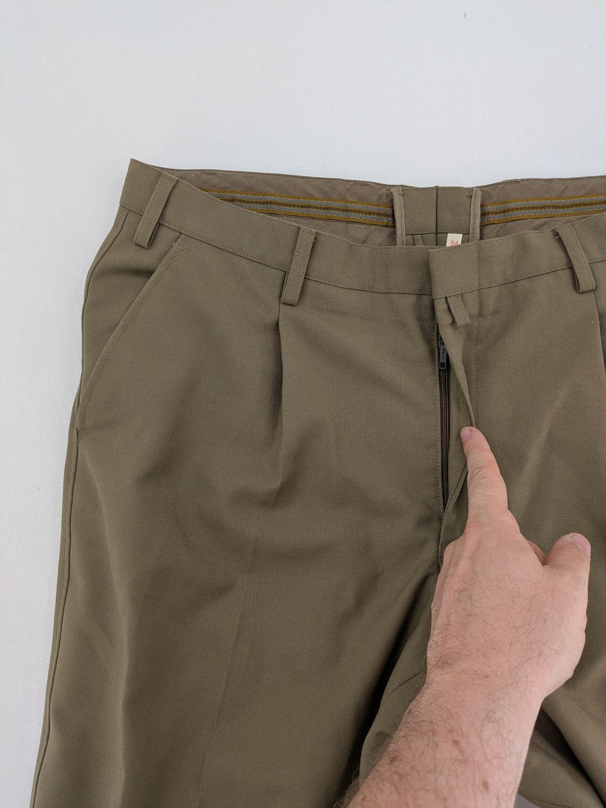Bundeswehr khaki military uniform trousers with front pleats, zipper, and belt loops.