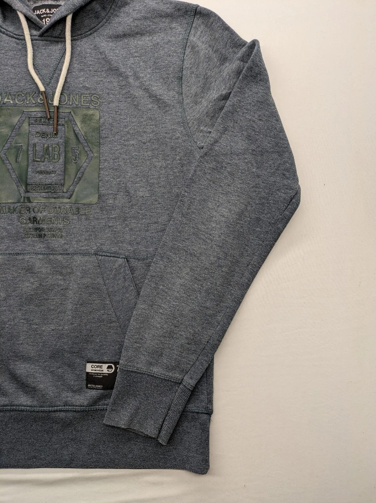 Jack & Jones green-grey hoodie with "Denim Lab" graphic, drawstring hood, kangaroo pocket.