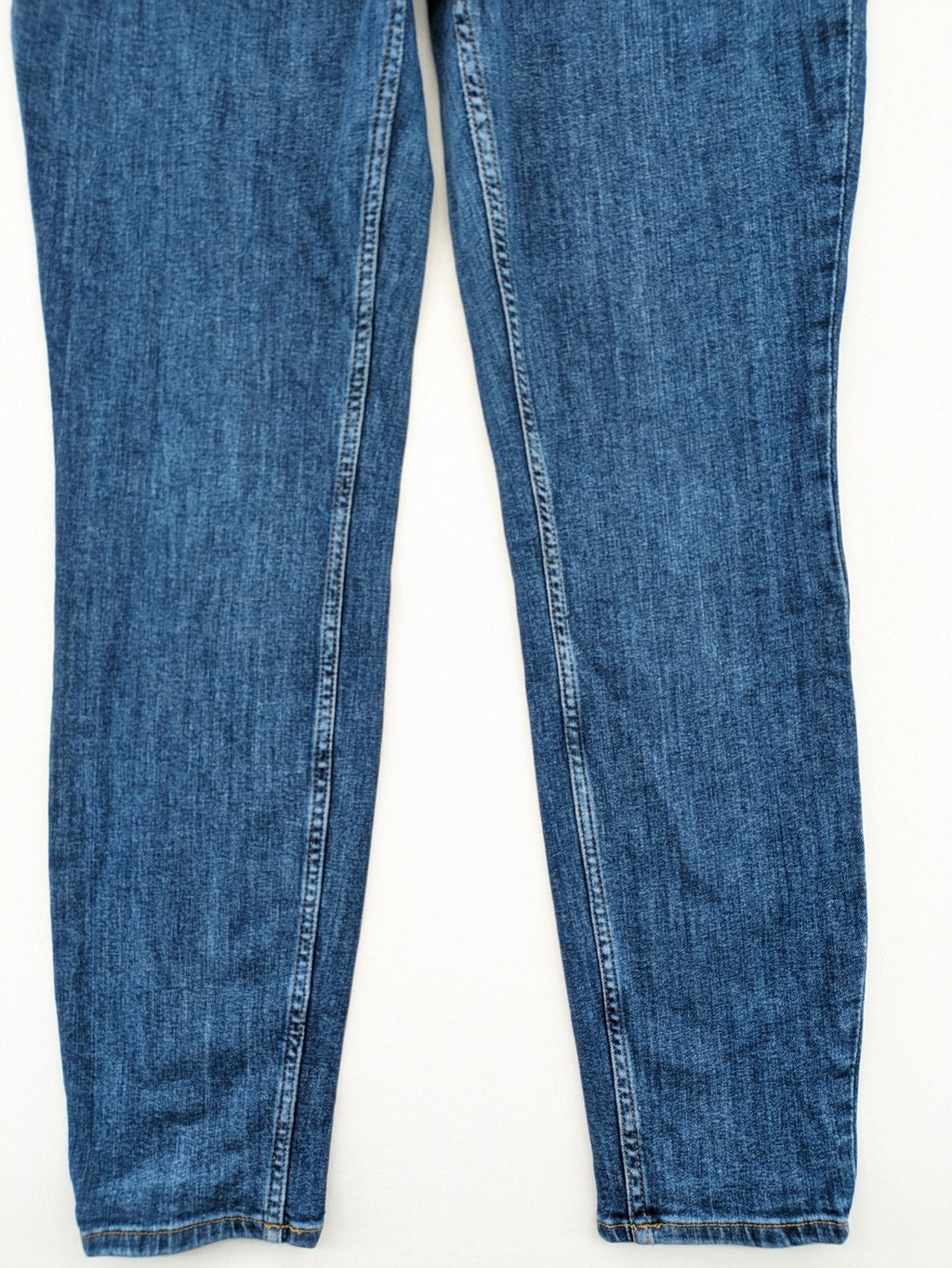 H&M blue skinny jeans with stretch denim and slim fit design.