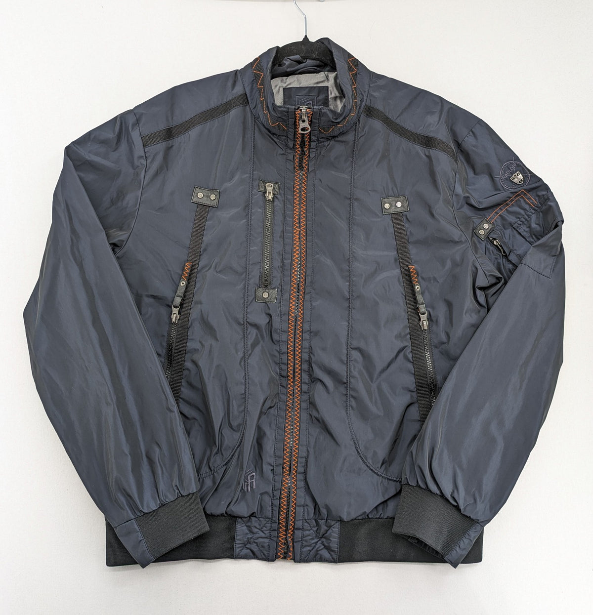 Radloff grey navy bomber jacket with orange contrast stitching and zippered pockets.