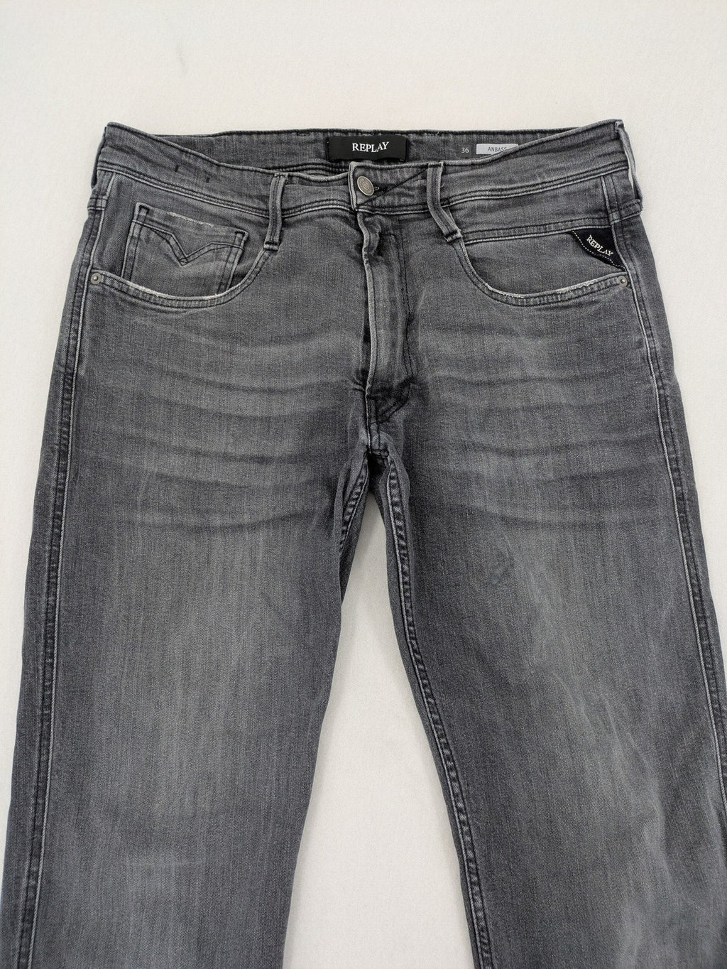 Replay grey straight jeans faded wash five-pocket style with logo on pocket.