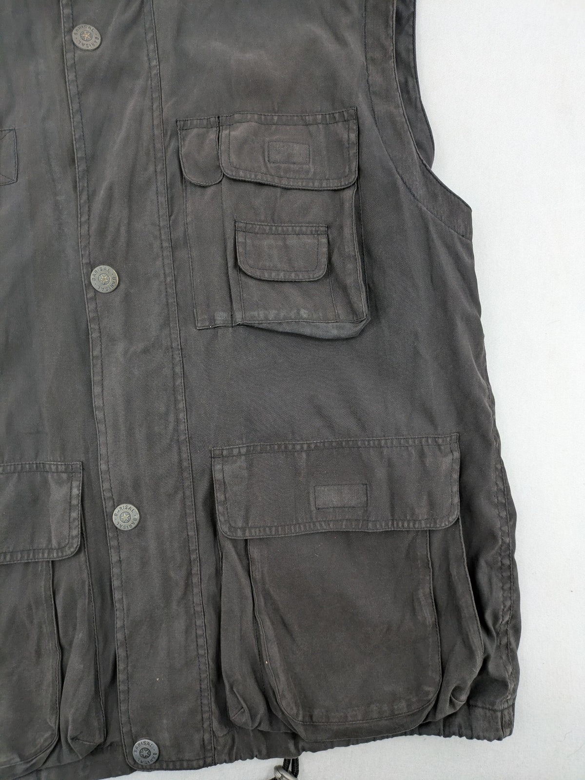 Barisal grey coat with hood, cargo pockets, and checkered lining detail.
