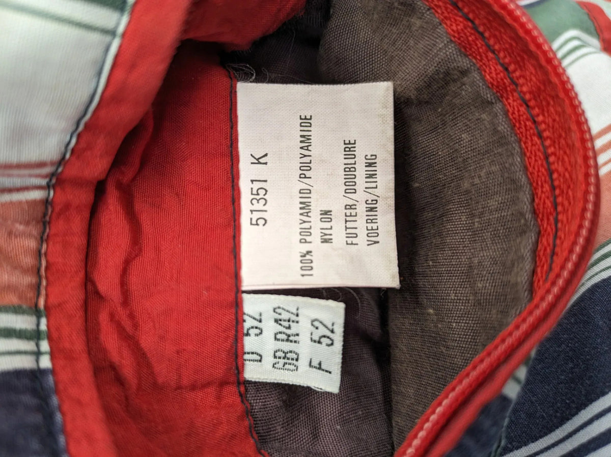 Bush Sportswear red trekking jacket with front zipper, multiple pockets, and striped lining.