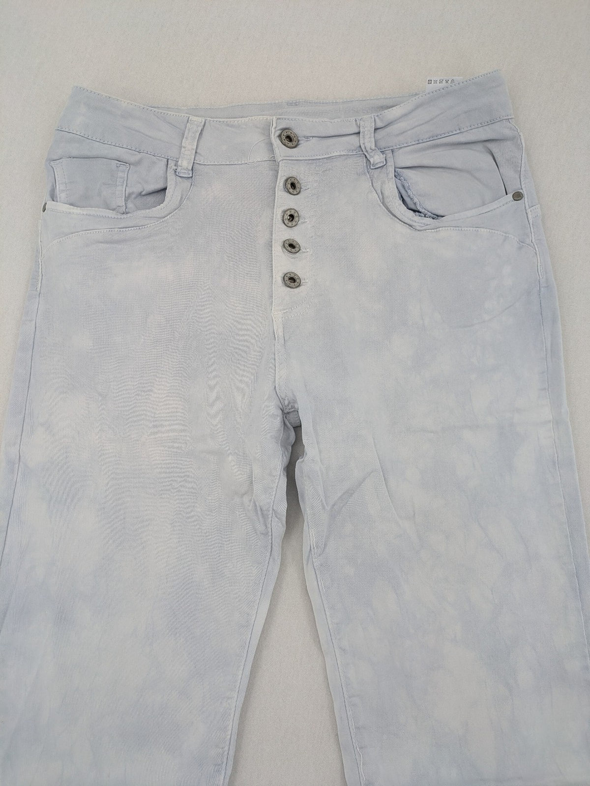 Yelly&Co blue and white batik pants with button fly, made from soft stretch fabric.