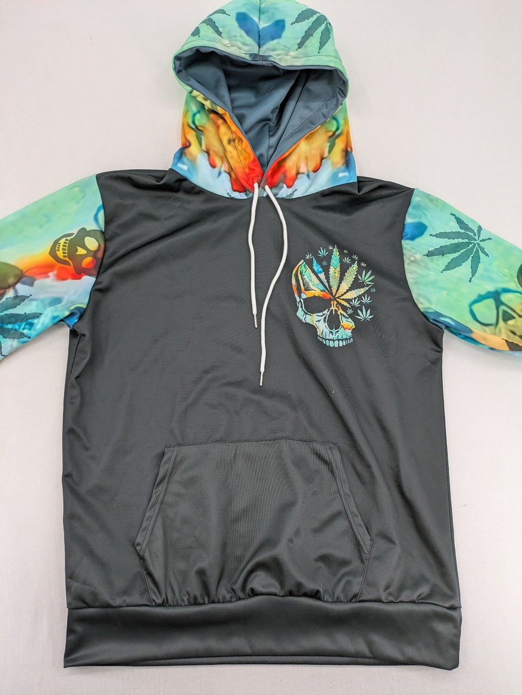 Skull tie-dye hoodie blue green with cannabis leaf graphic and bold text.