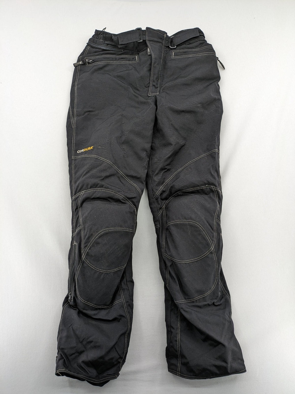 Rukka black motorcycle chaps with grey accents and CE knee protectors, made from durable Cordura.
