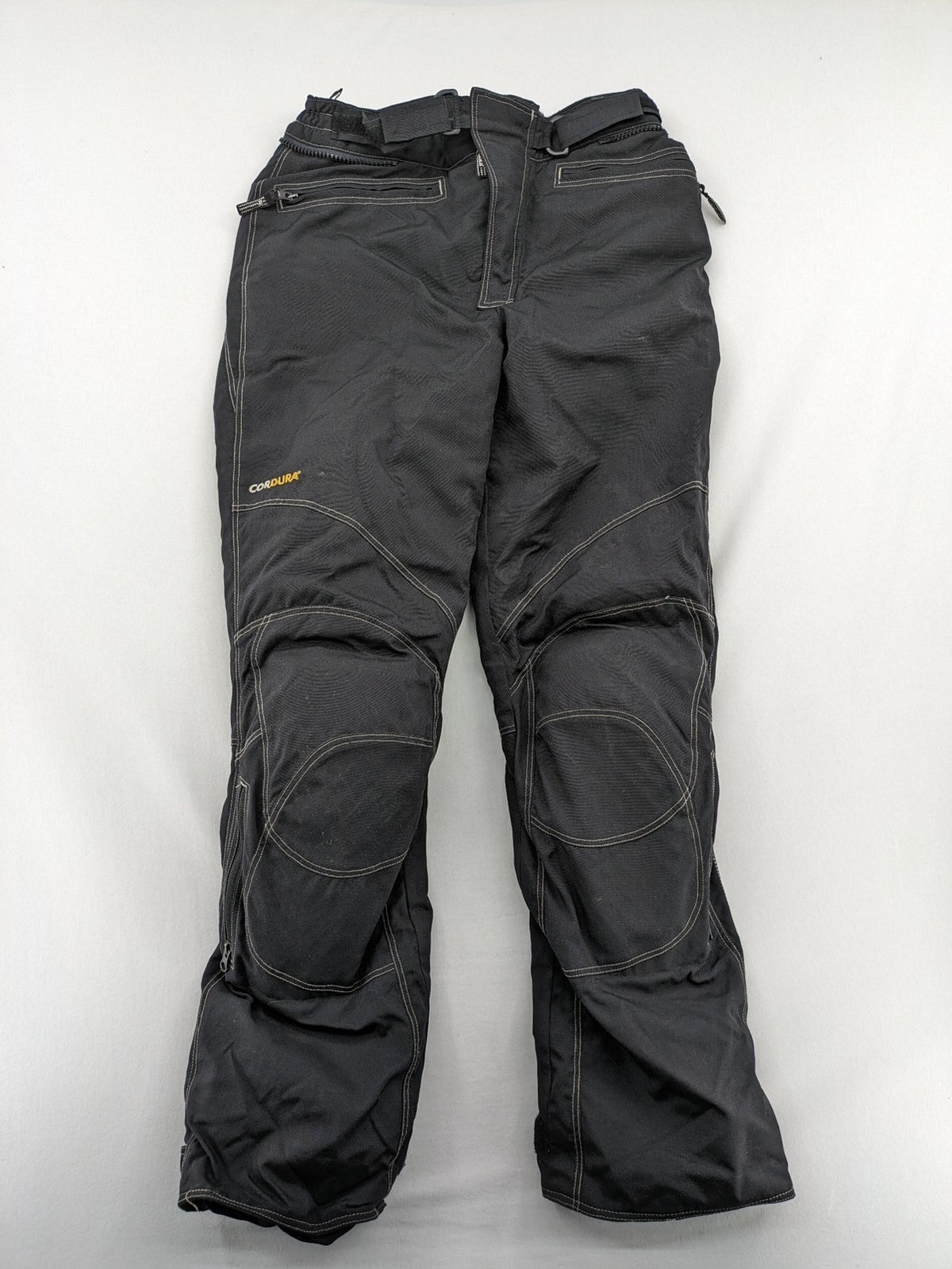 Rukka black motorcycle chaps with grey accents and CE knee protectors, made from durable Cordura.