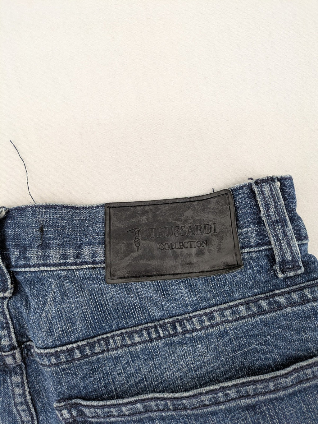 Trussardi blue straight jeans with classic 5-pocket design and durable denim material.