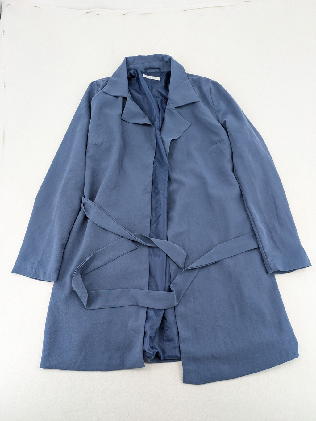 DeFacto blue trench coat with classic lapels and matching self-tie belt.