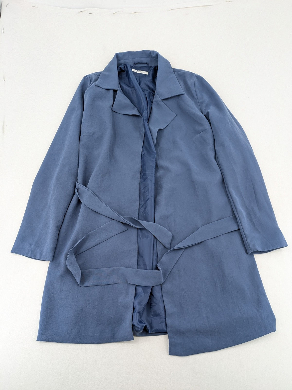 DeFacto blue trench coat with classic lapels and matching self-tie belt.