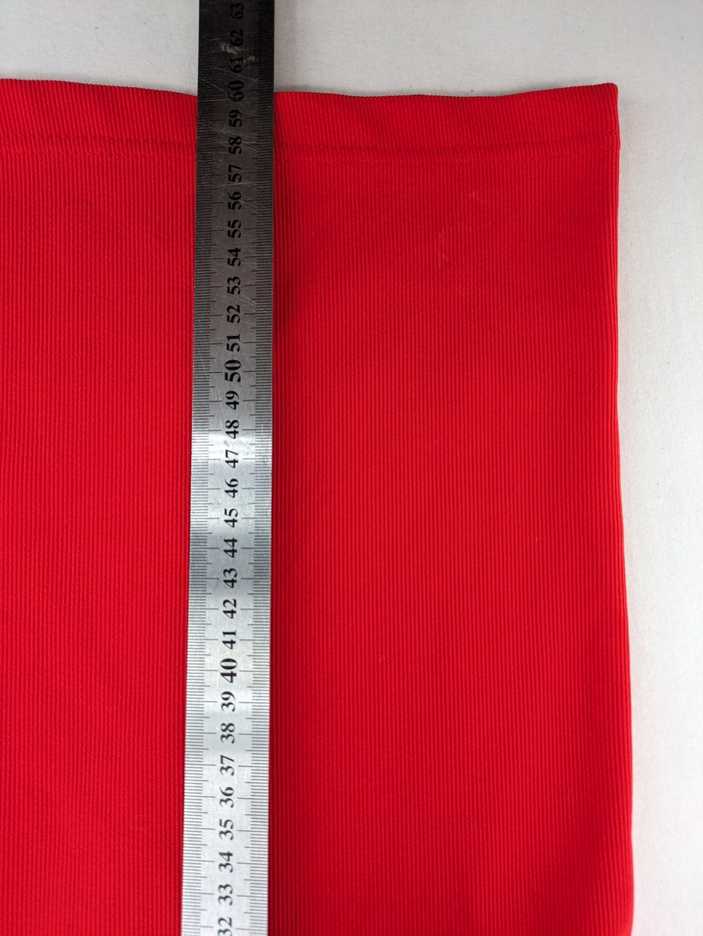 Hajo red t-shirt with ribbed texture and rhinestone Y-logo on chest.