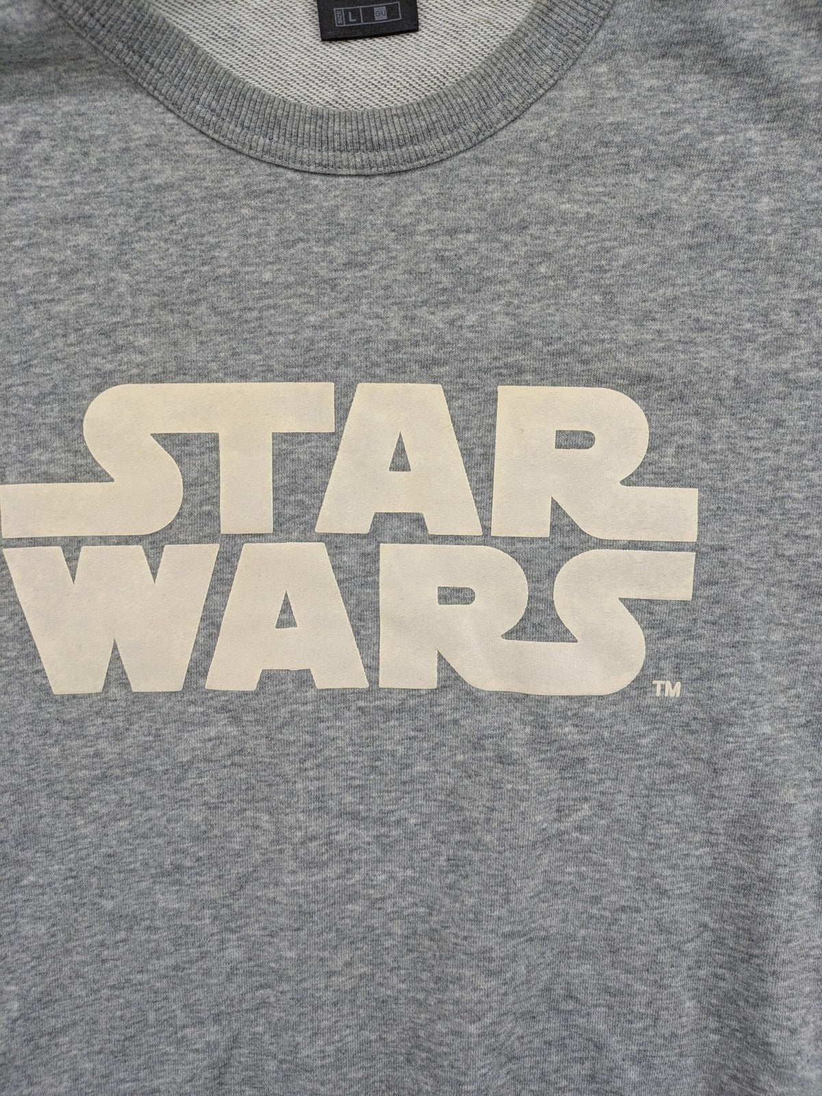 Star Wars grey short-sleeve sweatshirt with large cream logo print on chest.