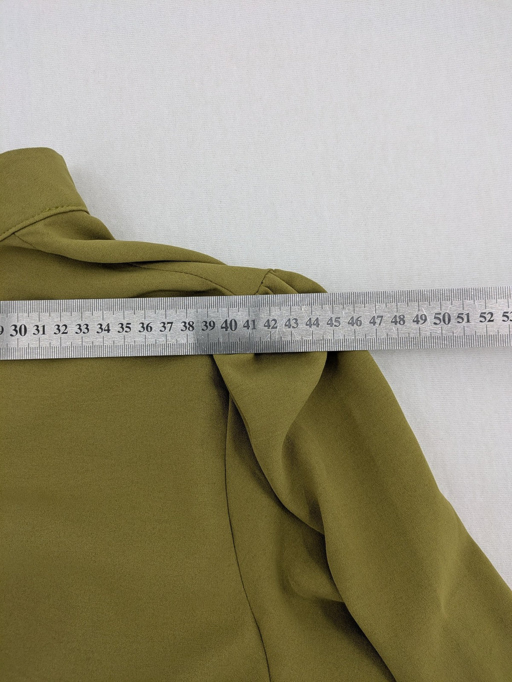 Buqre Store khaki A-line dress with puff sleeves, ruffled cuffs, and button placket.
