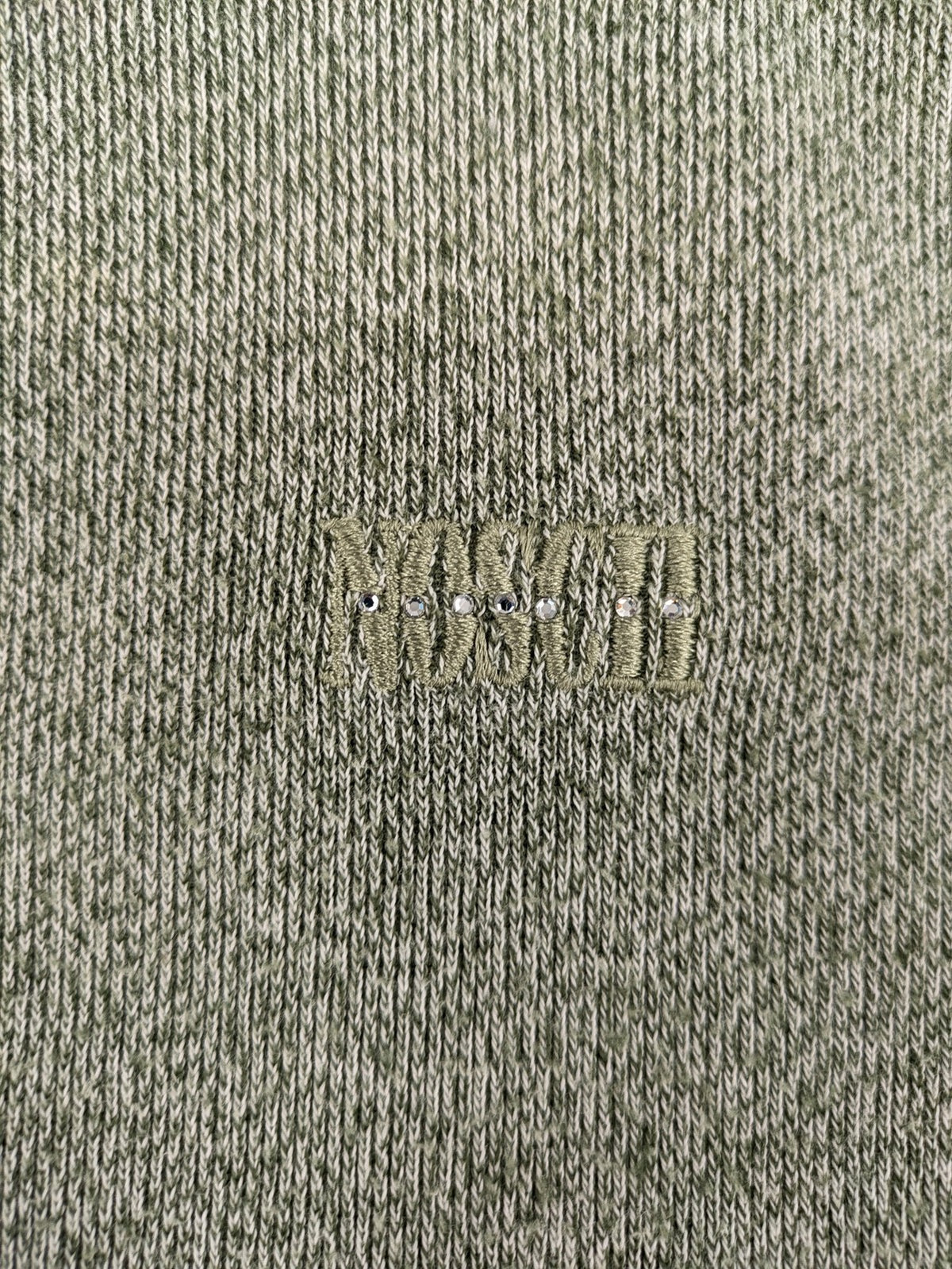 NOSCH knit jumper grey textured fabric with embroidered logo and subtle rhinestone accents.