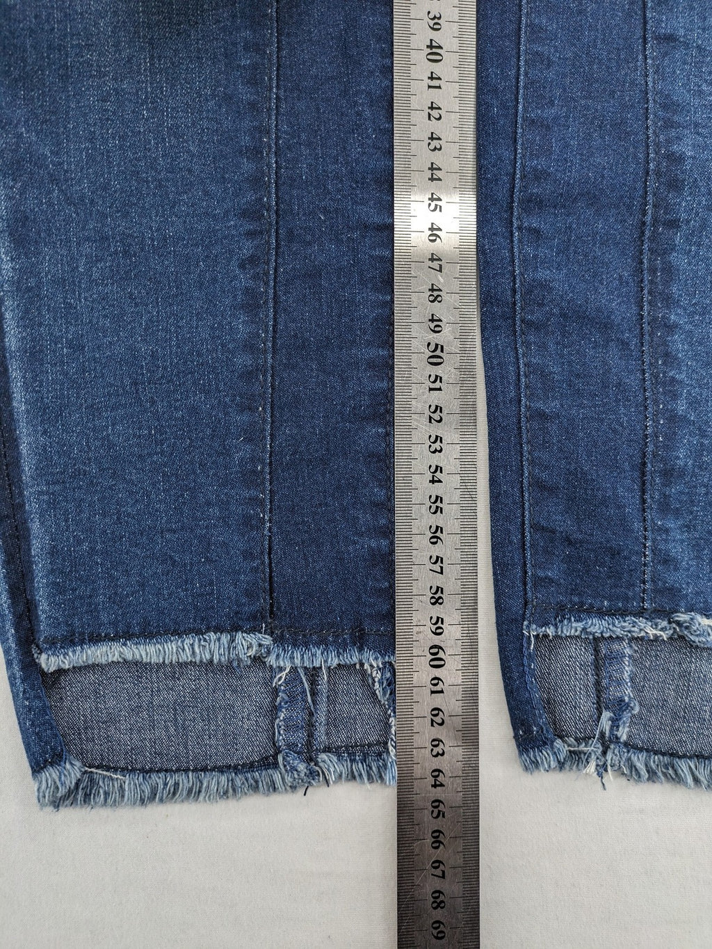 Best Connections blue skinny jeans with frayed hem and sporty side stripe.