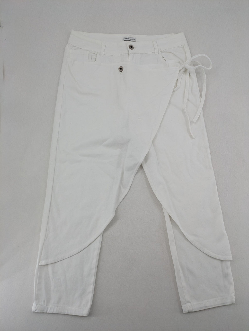 New Collection white straight jeans asymmetrical wrap design with side lacing and cotton-stretch material.