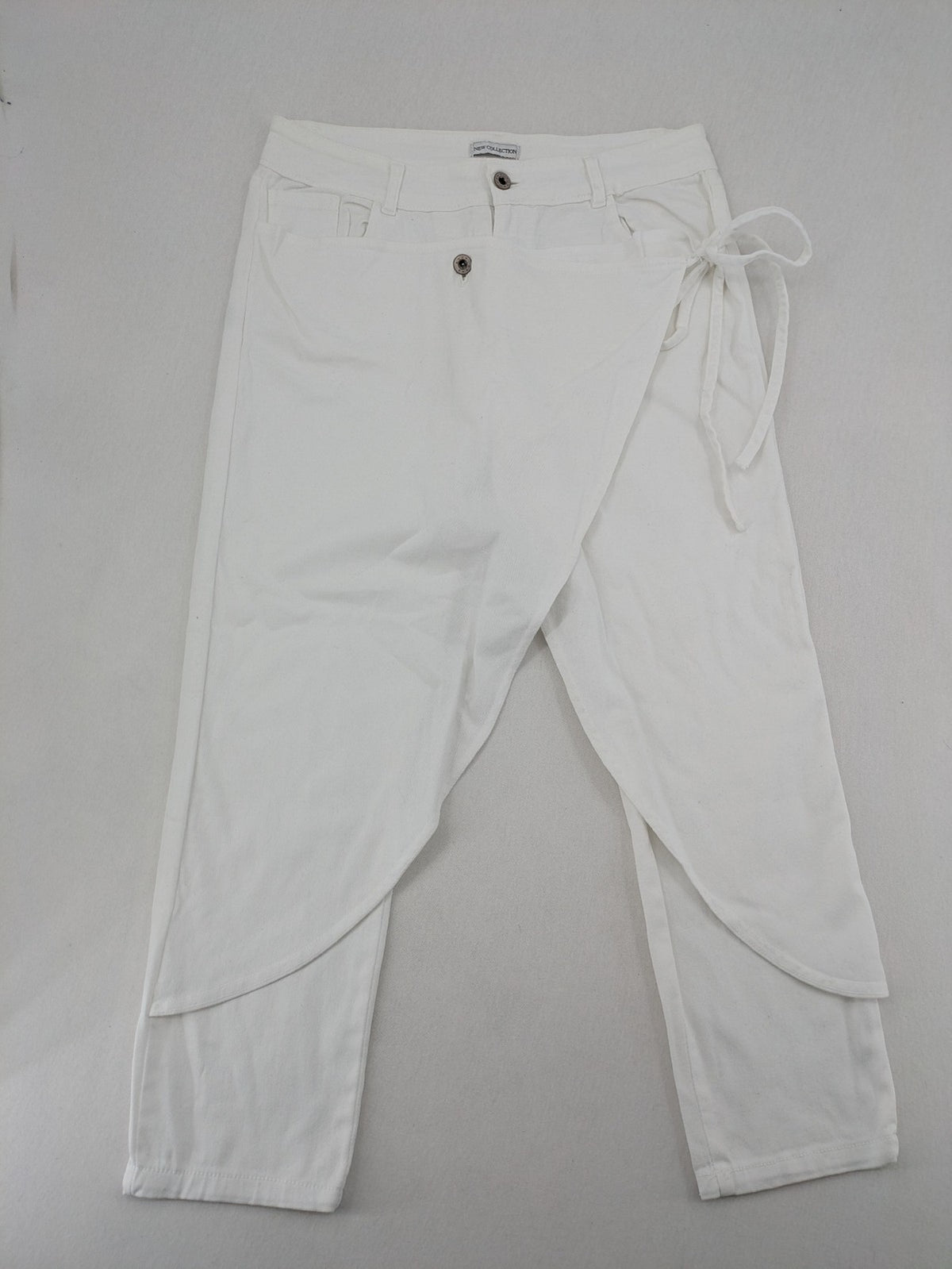 New Collection white straight jeans asymmetrical wrap design with side lacing and cotton-stretch material.