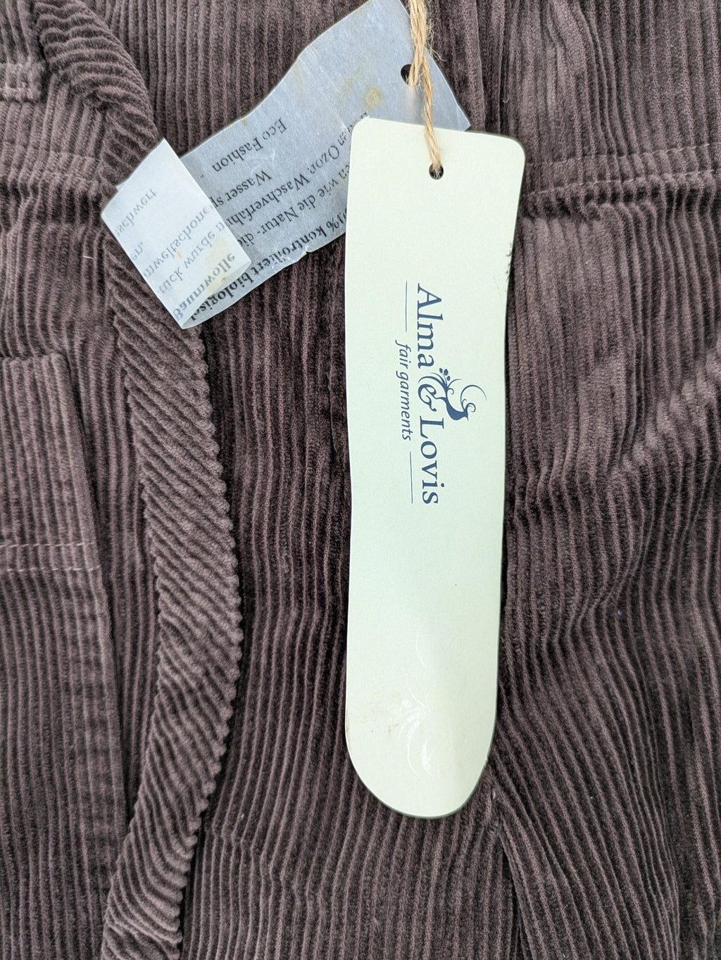 Alma & Lovis brown cord pants with drawstring, casual fit, and patch pockets.
