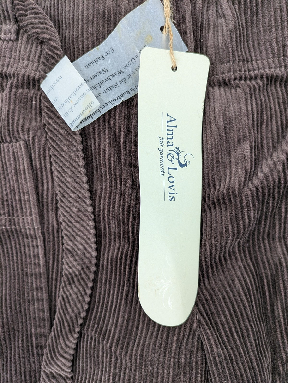 Alma & Lovis brown cord pants with drawstring, casual fit, and patch pockets.