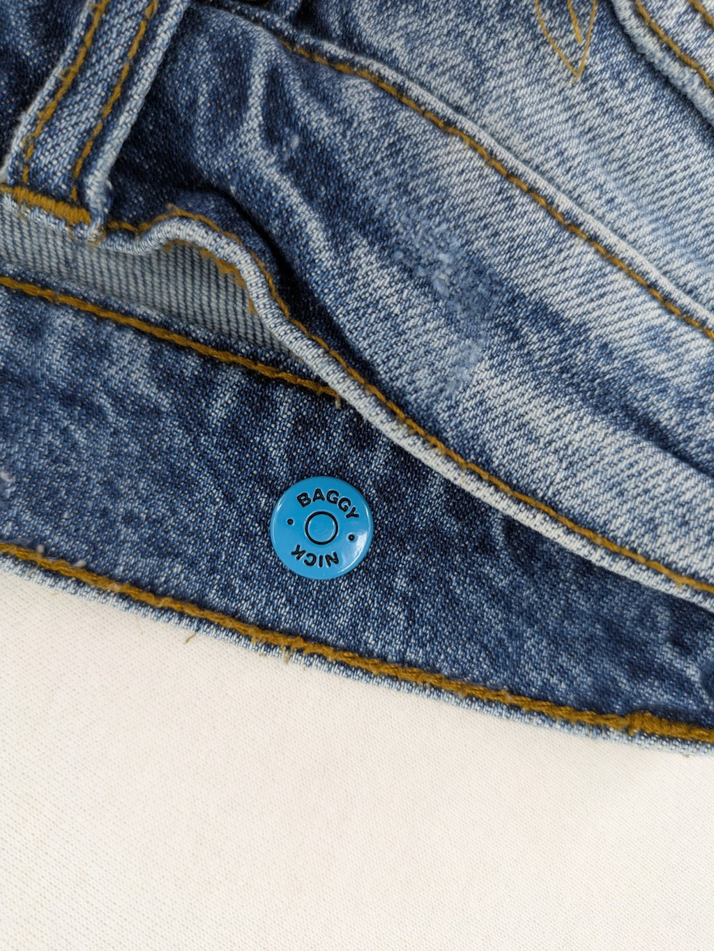 FSBN blue straight jeans with ripped distressed knees and classic button fly.