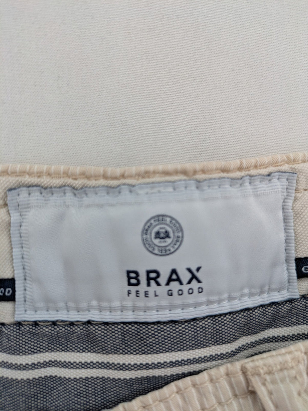 BRAX beige striped pants with logo, made from comfortable stretch cotton blend.