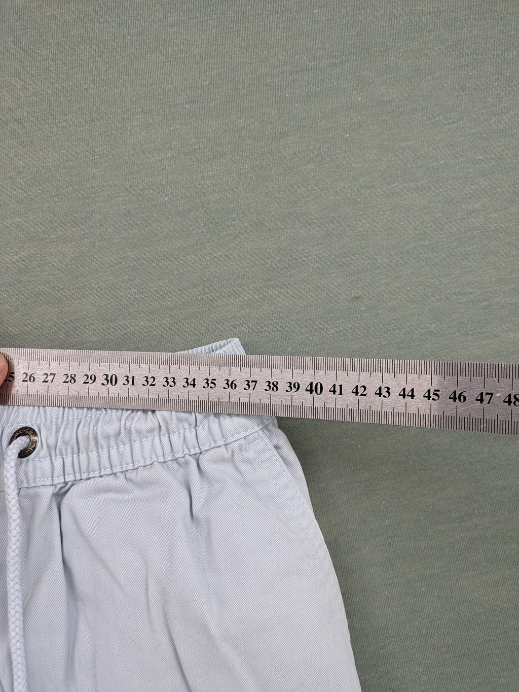 Bench blue shorts with elastic waistband, drawstring, and multiple pockets.