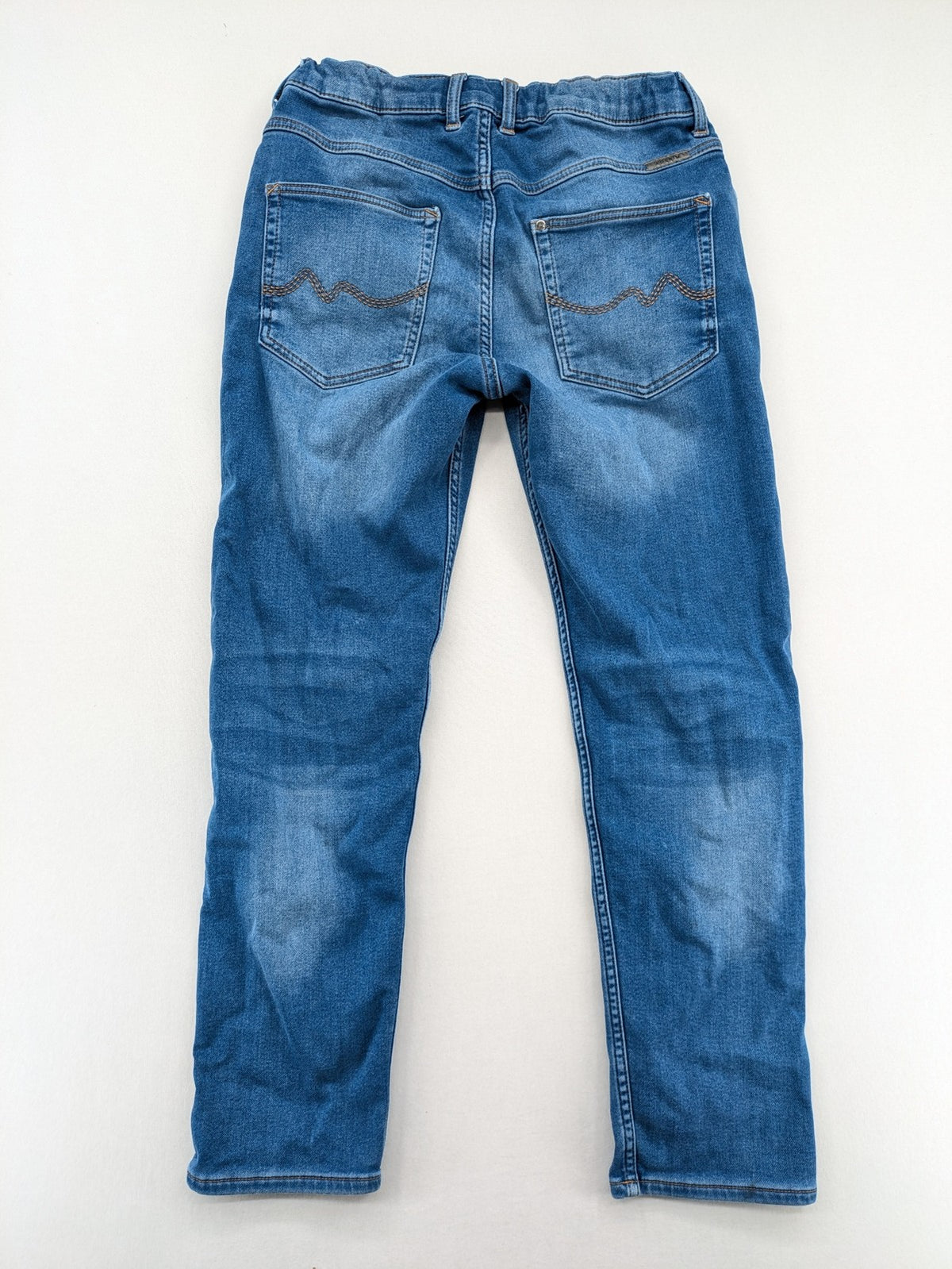 H&M blue straight jeans with elastic waistband and white drawstring, casual jogger style.