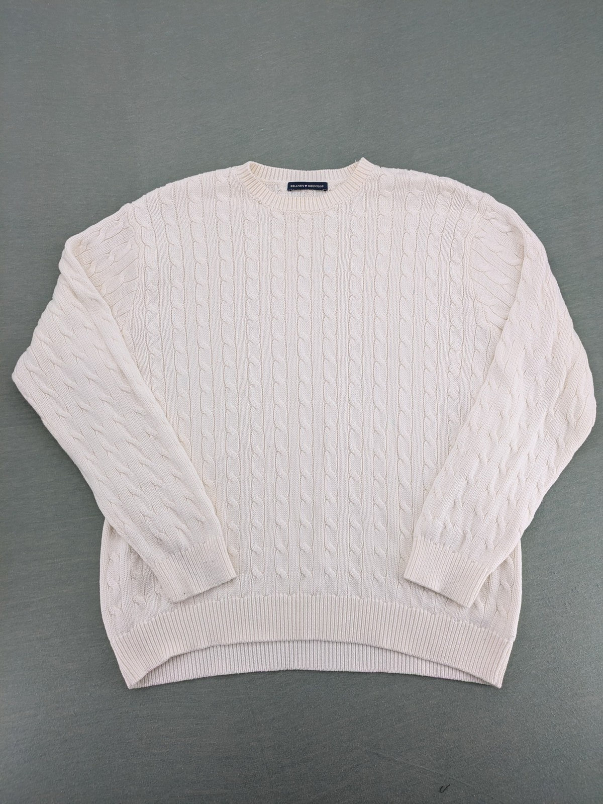Brandy Melville cream turtle neck jumper with allover cable knit pattern and ribbed hem.
