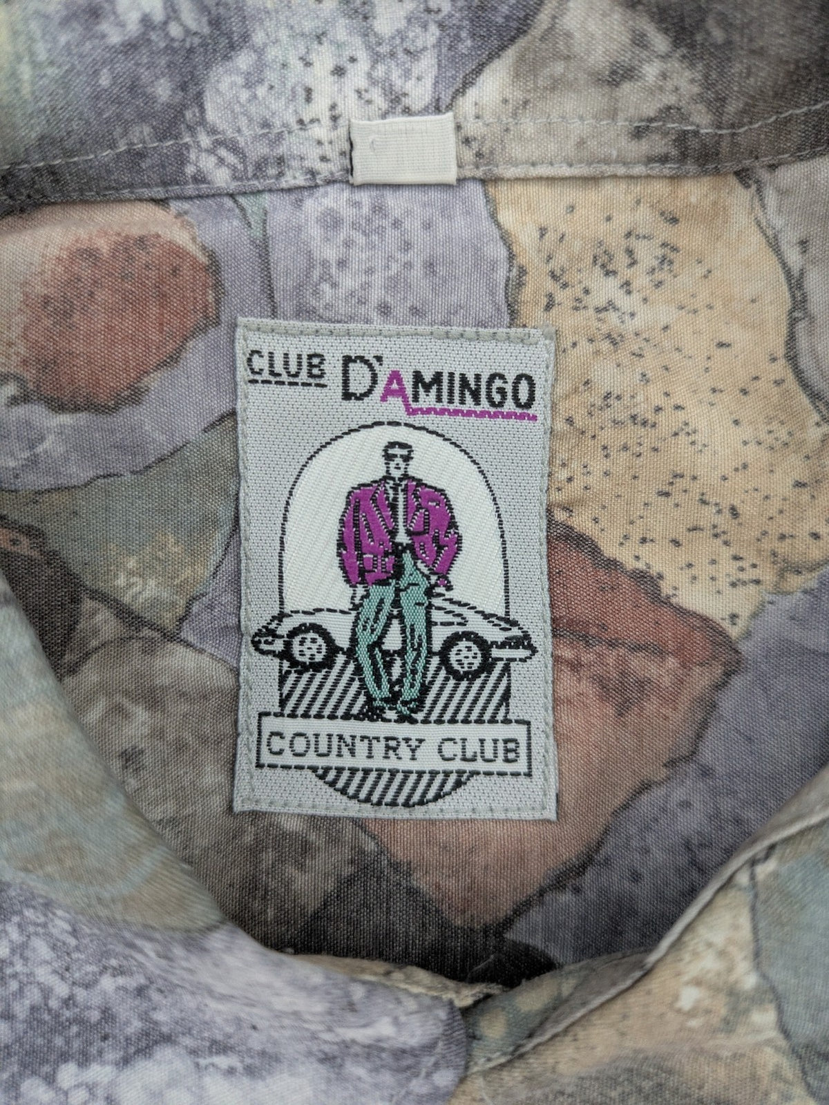 Club D'Amingo short sleeve shirt multi abstract geometric pattern in earthy tones.
