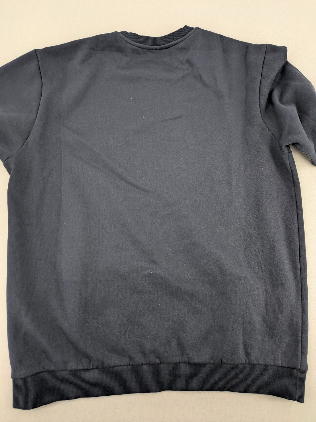 G-Unit navy turtle neck jumper with vertical logo graphic and soft fleece interior.