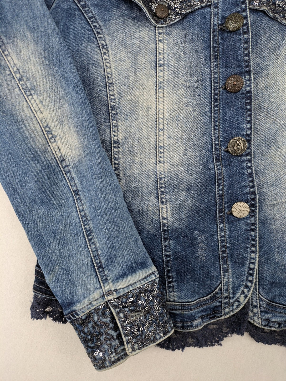 TREDY blue denim jacket with sequins, lace trim, and fitted design.