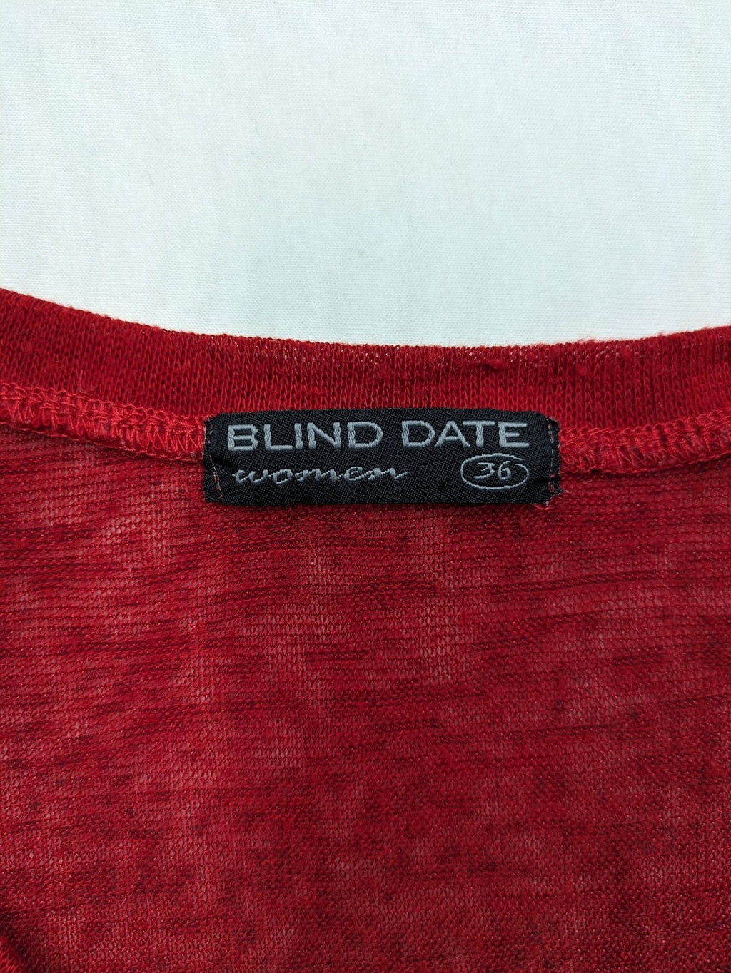 BLIND DATE cream red long sleeve top with sparkling OMG rhinestone design and classic round neckline.