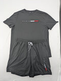 Manfinity loungewear set black T-shirt and shorts with Paris graphic print.