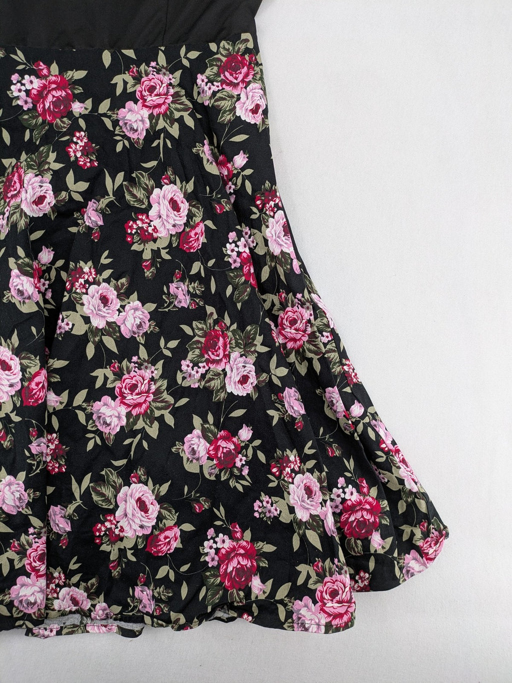 M/L black A-line dress with floral skirt and lace trim details.