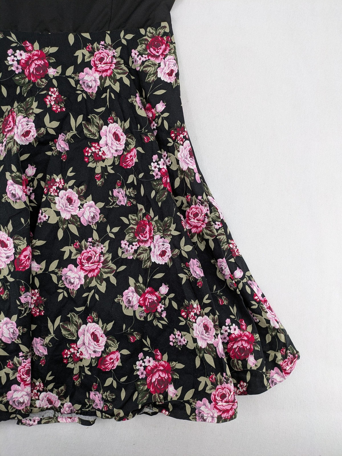 M/L black A-line dress with floral skirt and lace trim details.