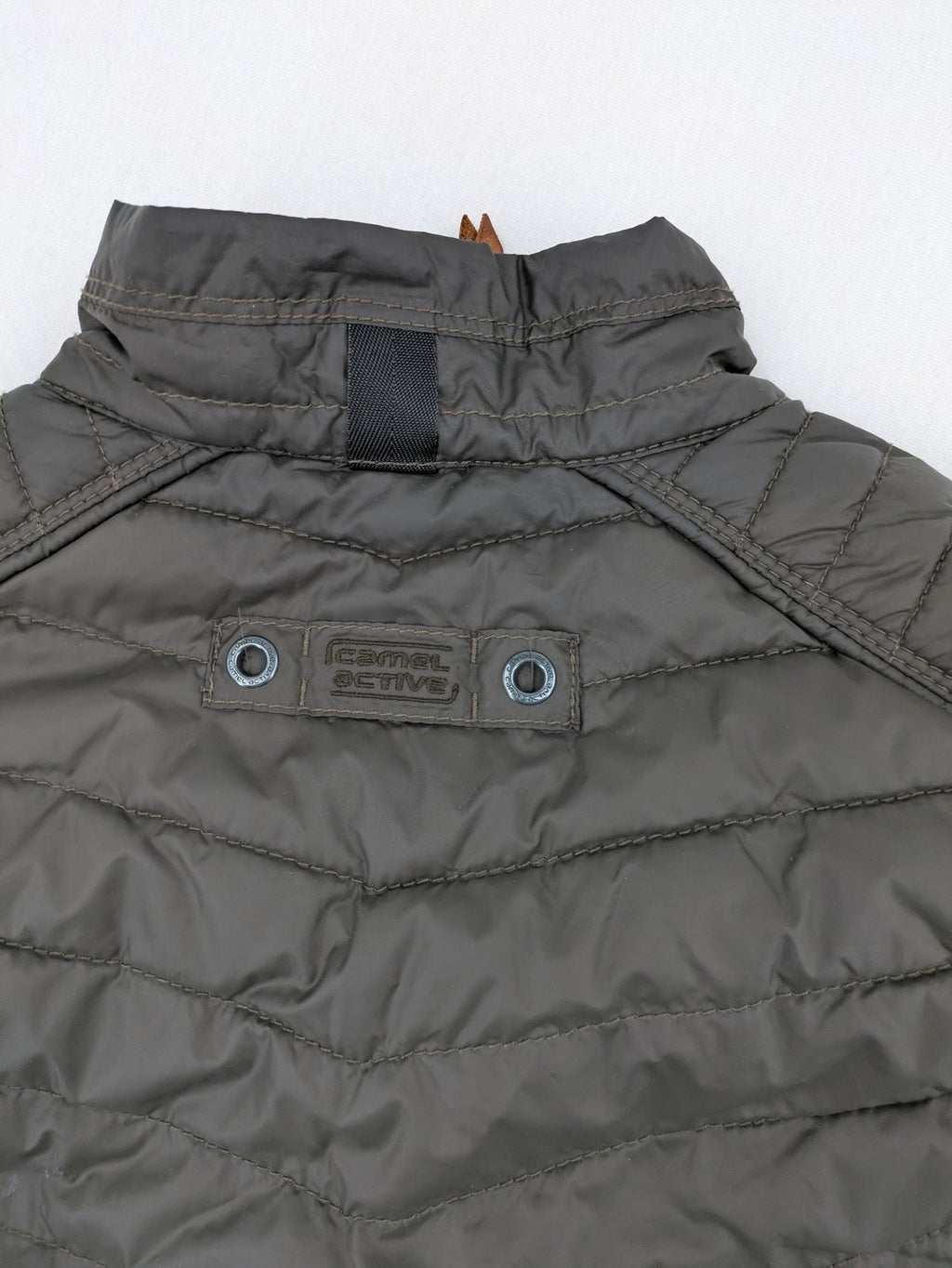 Camel Active khaki vest with full zip, quilted design, checkered lining, water-resistant.