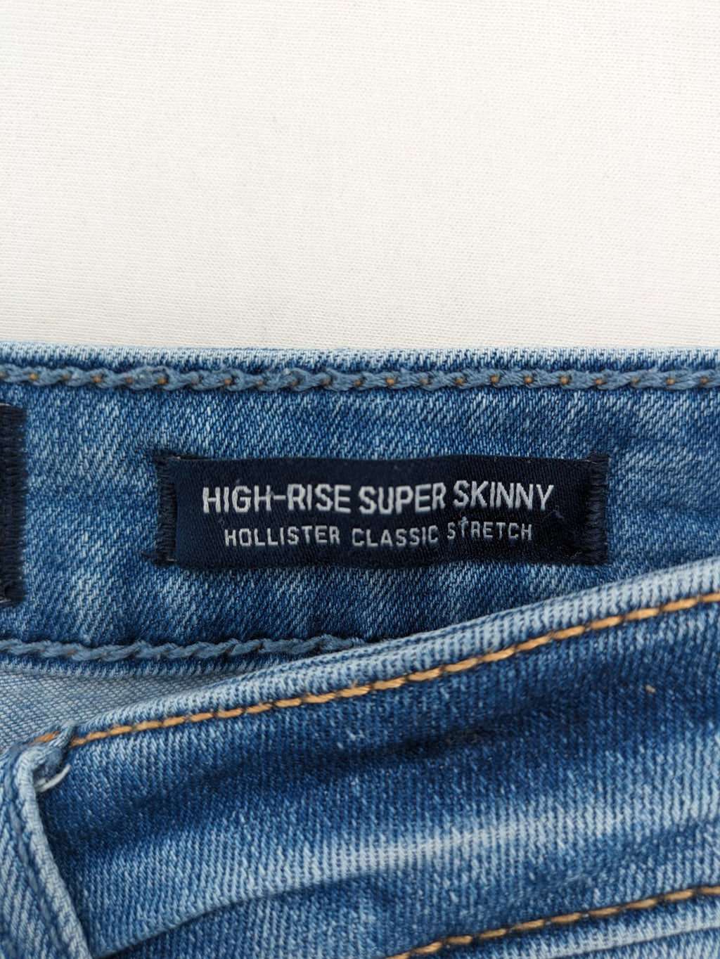 Hollister blue high rise super skinny jeans with frayed hem and classic stretch denim.